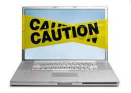 Caution Tape on Laptop